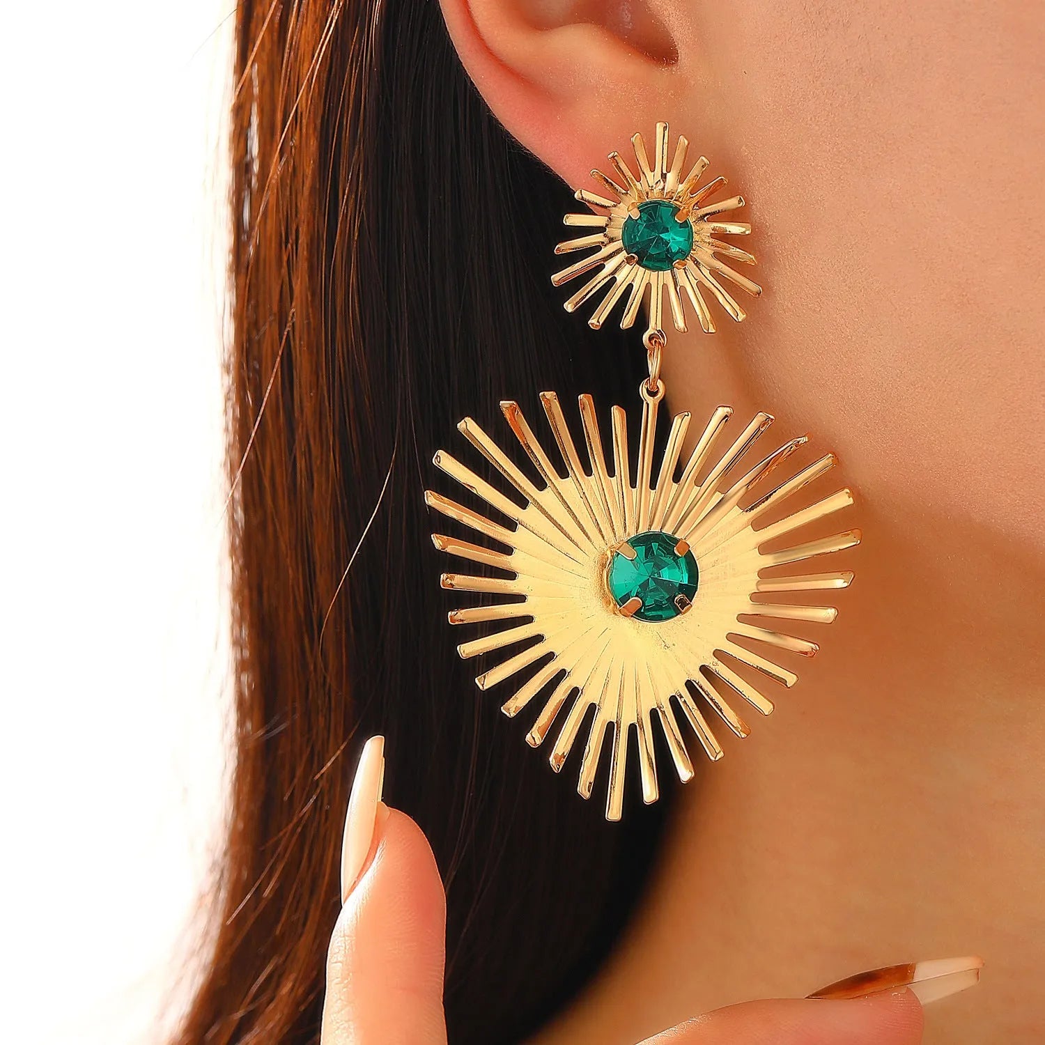 Alloy bohemian sunflower heart-shaped earrings with rhinestones in gold finish on white background