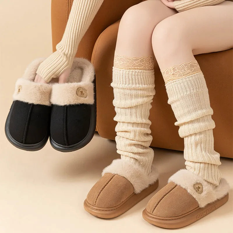 Plush fleece slippers with thick PVC soles in five colour options showing car stitching detail