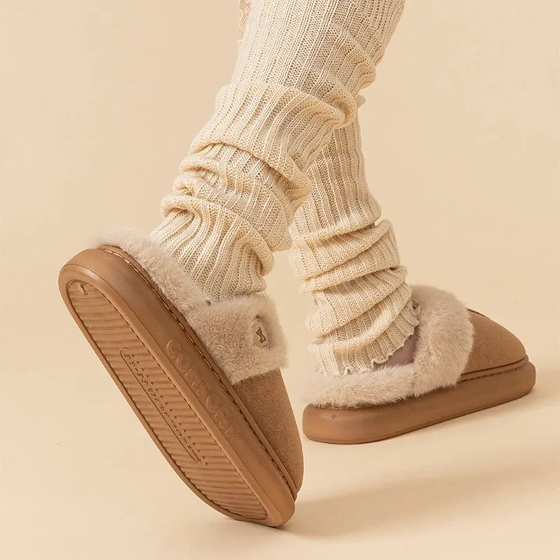 Plush fleece slippers with thick PVC soles in five colour options showing car stitching detail