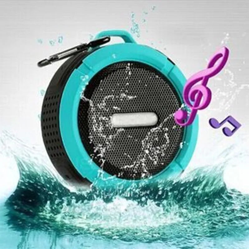Portable waterproof Bluetooth speaker with carabiner clip in black, blue, green, red, or yellow colours