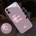 Luminous white daisy design iPhone case with voice-activated colour lights on a phone
