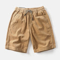 Men's khaki cargo shorts with street style straight-leg cut and polyester fabric