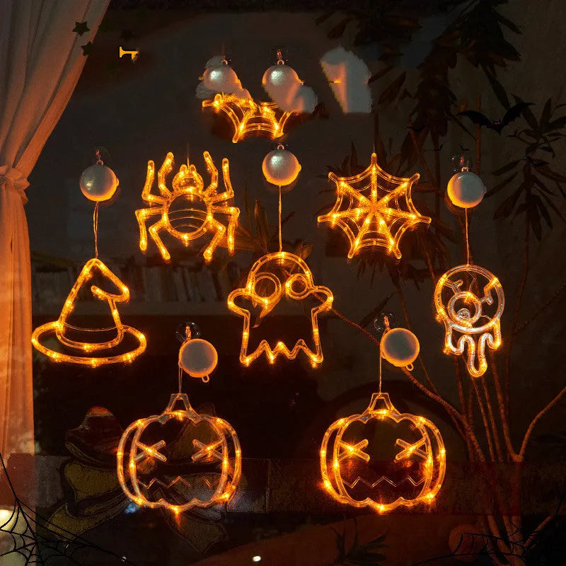 Halloween window hanging LED lights set with seven designs including spiders, pumpkins, and ghosts
