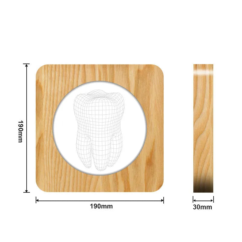 Wood-colour tooth-shaped acrylic USB night lamp on a surface