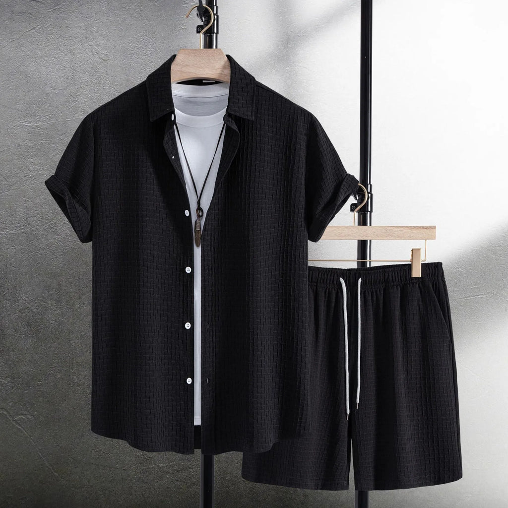 Men's loose-fit cotton blend shirt and shorts co-ord set in solid black colour.