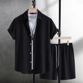 Men's loose-fit cotton blend shirt and shorts co-ord set in solid black colour.