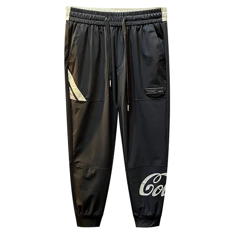 Black men's cropped casual trousers with an ankle band, made from ultra-thin cotton fabric.