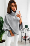 Women's long grey batwing sleeve cardigan sweatshirt with stitching detail and three buttons.