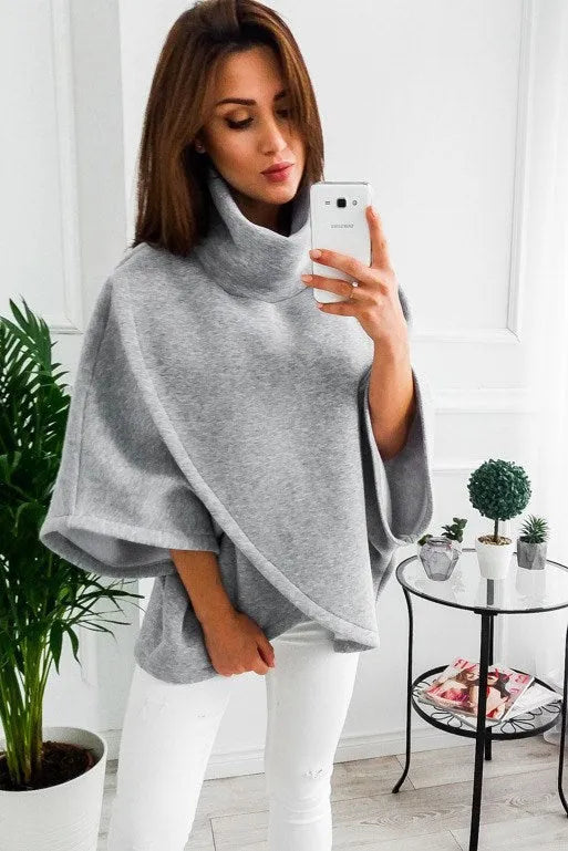 Women's long grey batwing sleeve cardigan sweatshirt with stitching detail and three buttons.