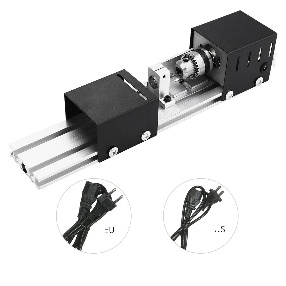 Silver metal mini manual woodworking lathe on a bench with carving knives and accessories.