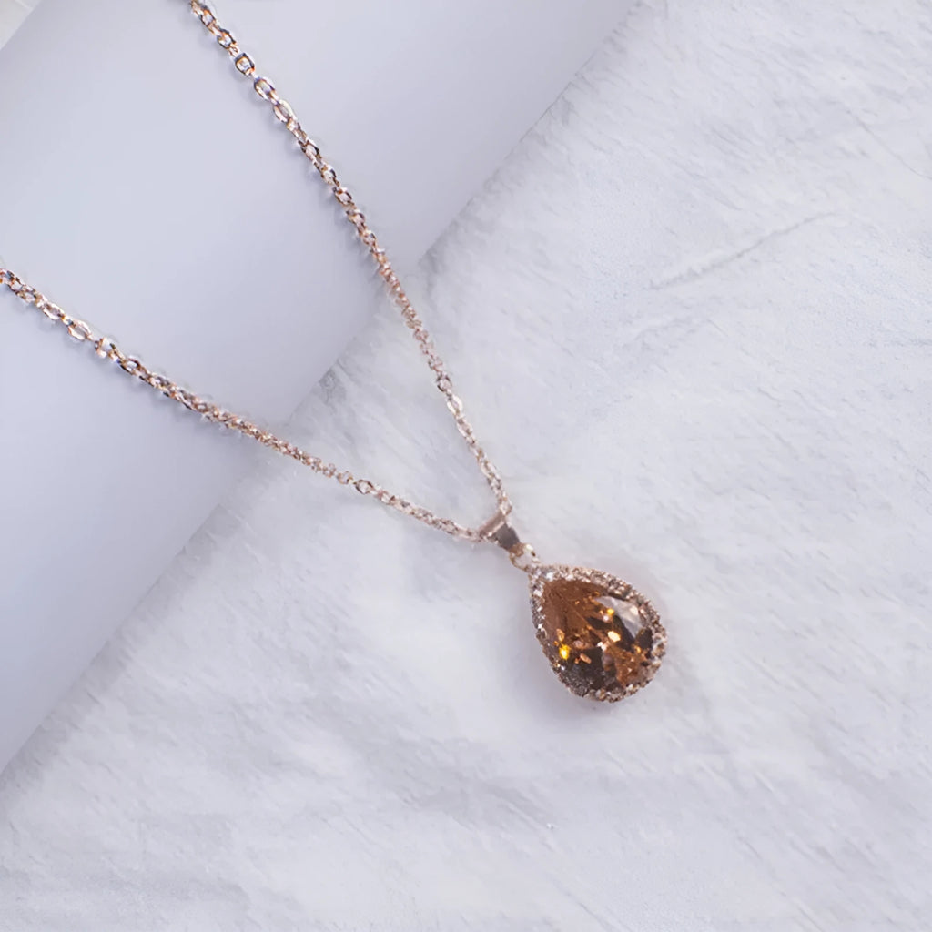 Women's rose gold rhinestone drop shape necklace with geometric design and alloy construction