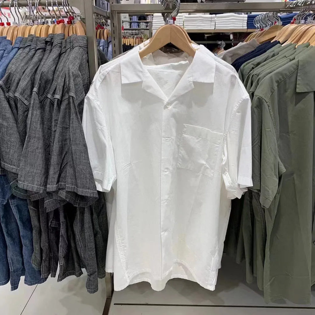 Man wearing a beige modal cotton open collar cardigan-style casual shirt.