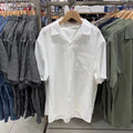 Man wearing a beige modal cotton open collar cardigan-style casual shirt.