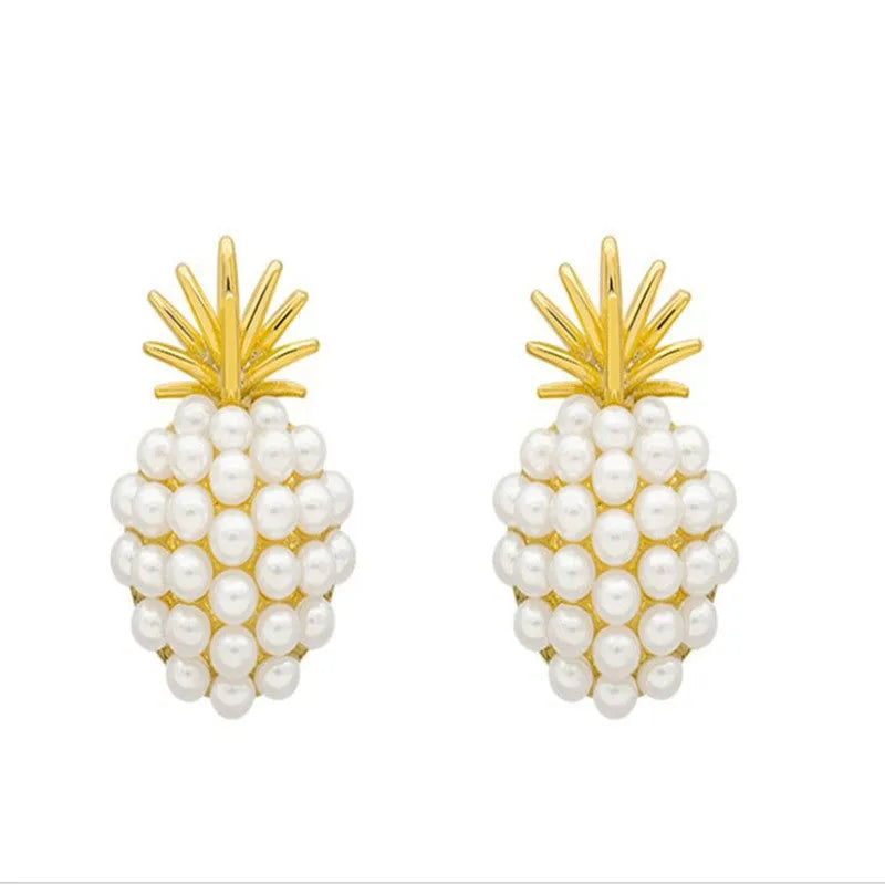 Women's gold electroplated alloy drop earrings with pineapple design and starfish pearl, featuring inlaid stones.