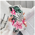 Pink floral design TPU phone case for iPhone on a table