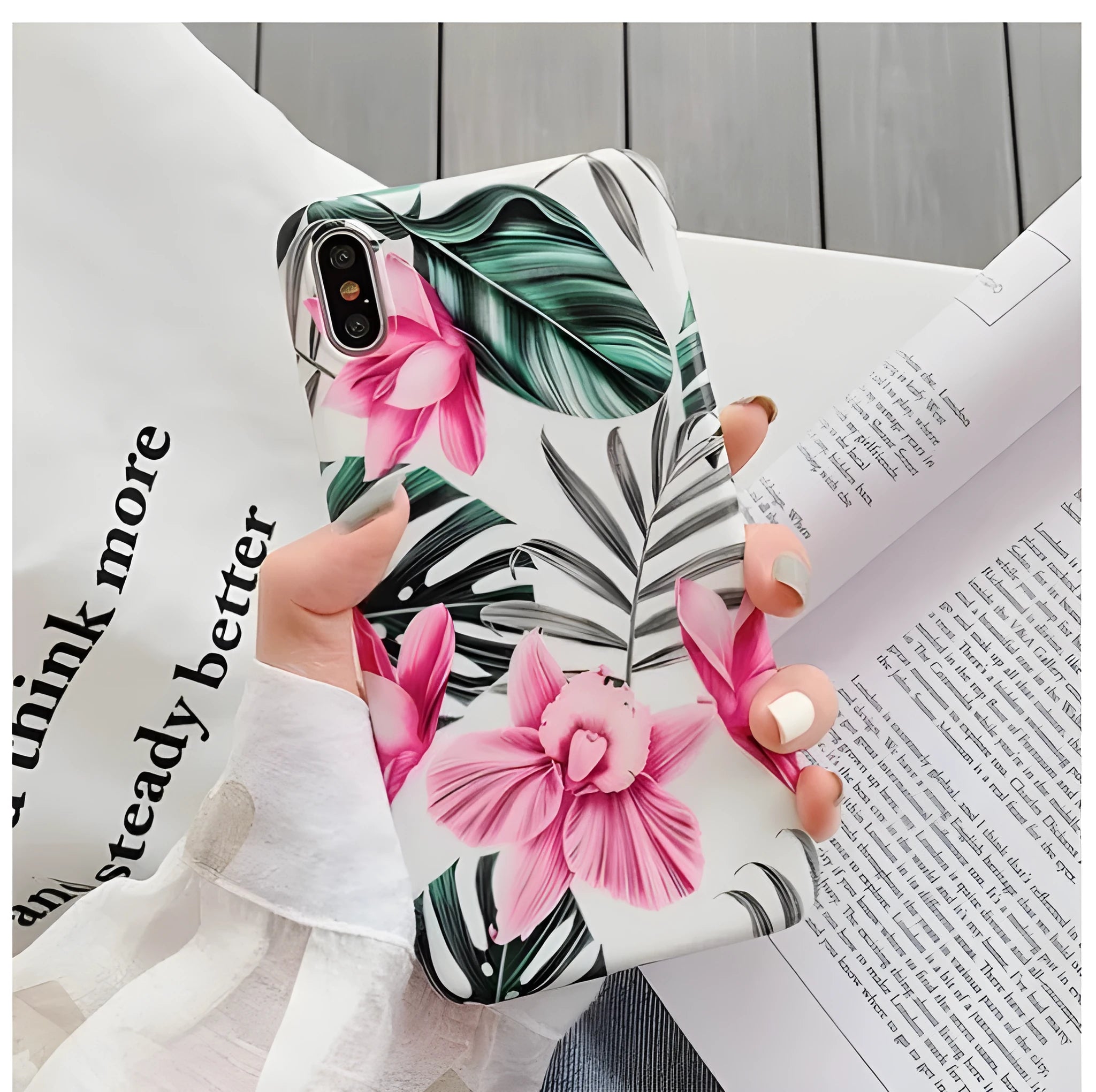 Pink floral design TPU phone case for iPhone on a table