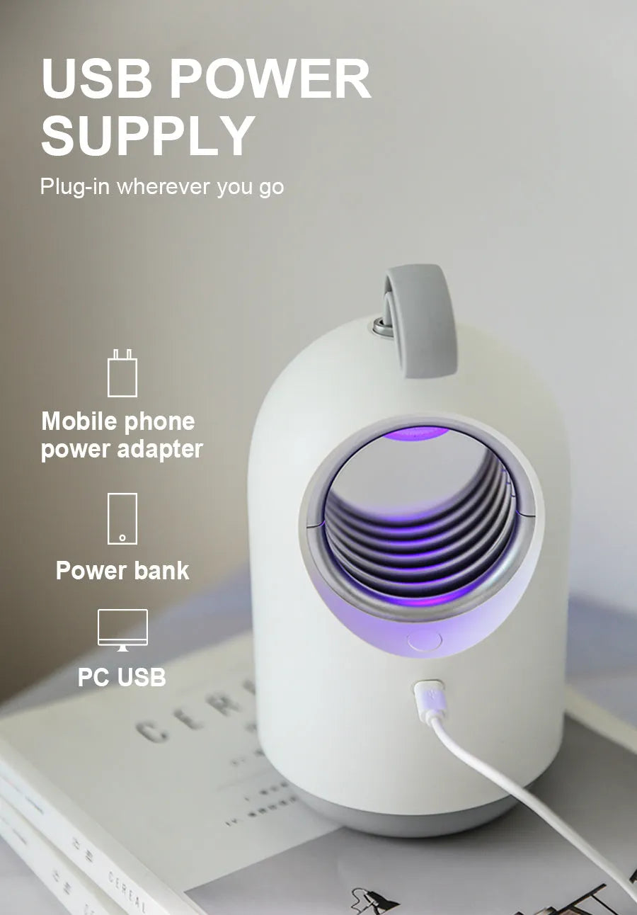 White and blue indoor mosquito killer lamp with UV light, fan, USB cable, and a top carry handle.