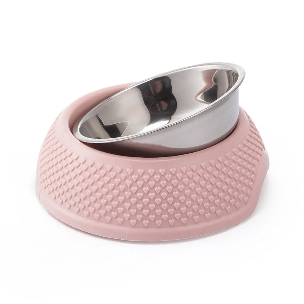 Blue stainless steel pet bowl with a non-slip black base on a kitchen floor.