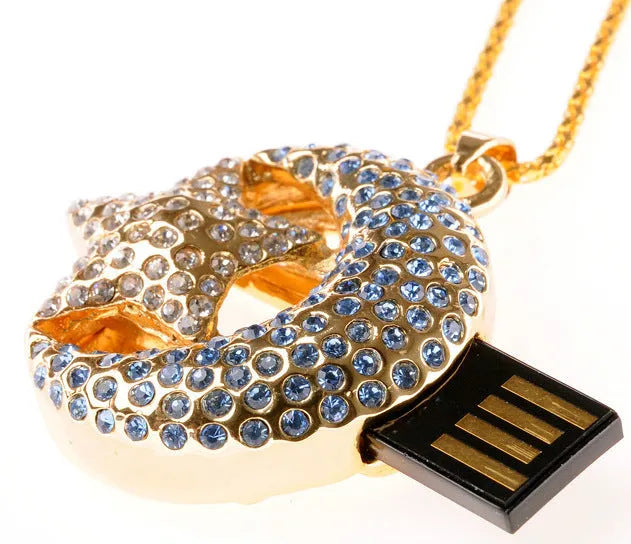 Xingyue jewellery-shaped metal USB flash drive on a white background.
