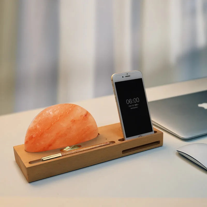 Sunrise Oriental wooden base table lamp with natural salt shade and built-in wireless phone charger.