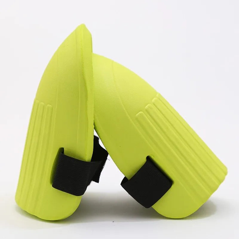 A pair of thick black EVA foam knee pads for garden kneeling, showing size and cushioning.
