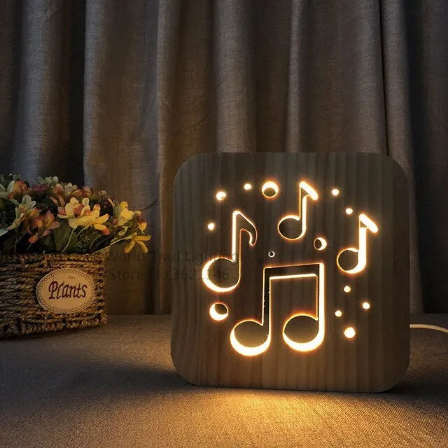 Square wooden USB LED atmosphere light with laser-cut design glowing warm white.