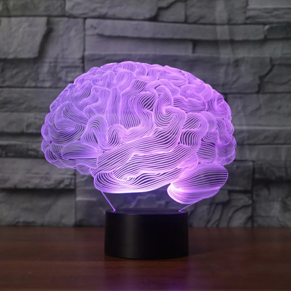 3D brain illusion desk lamp with colour-changing LED lights and remote control on wooden surface