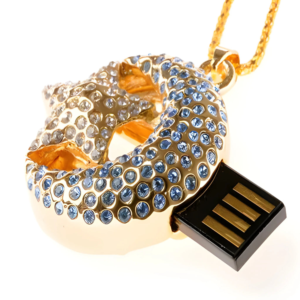 Xingyue jewellery-shaped metal USB flash drive on a white background.