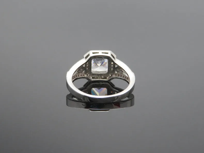 Geometric hollow women's ring with zircon stones in platinum colour