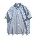 Blue striped loose fit overalls shirt with short sleeves on hanger