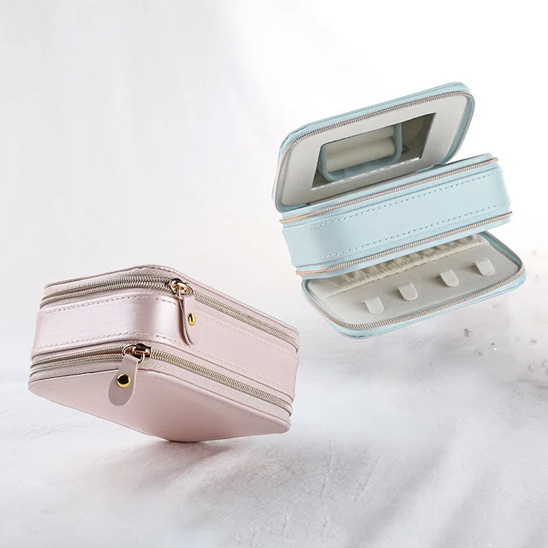 Light blue PU leather zipper jewellery box on a flat surface, compact 11.5x8.5x5cm size