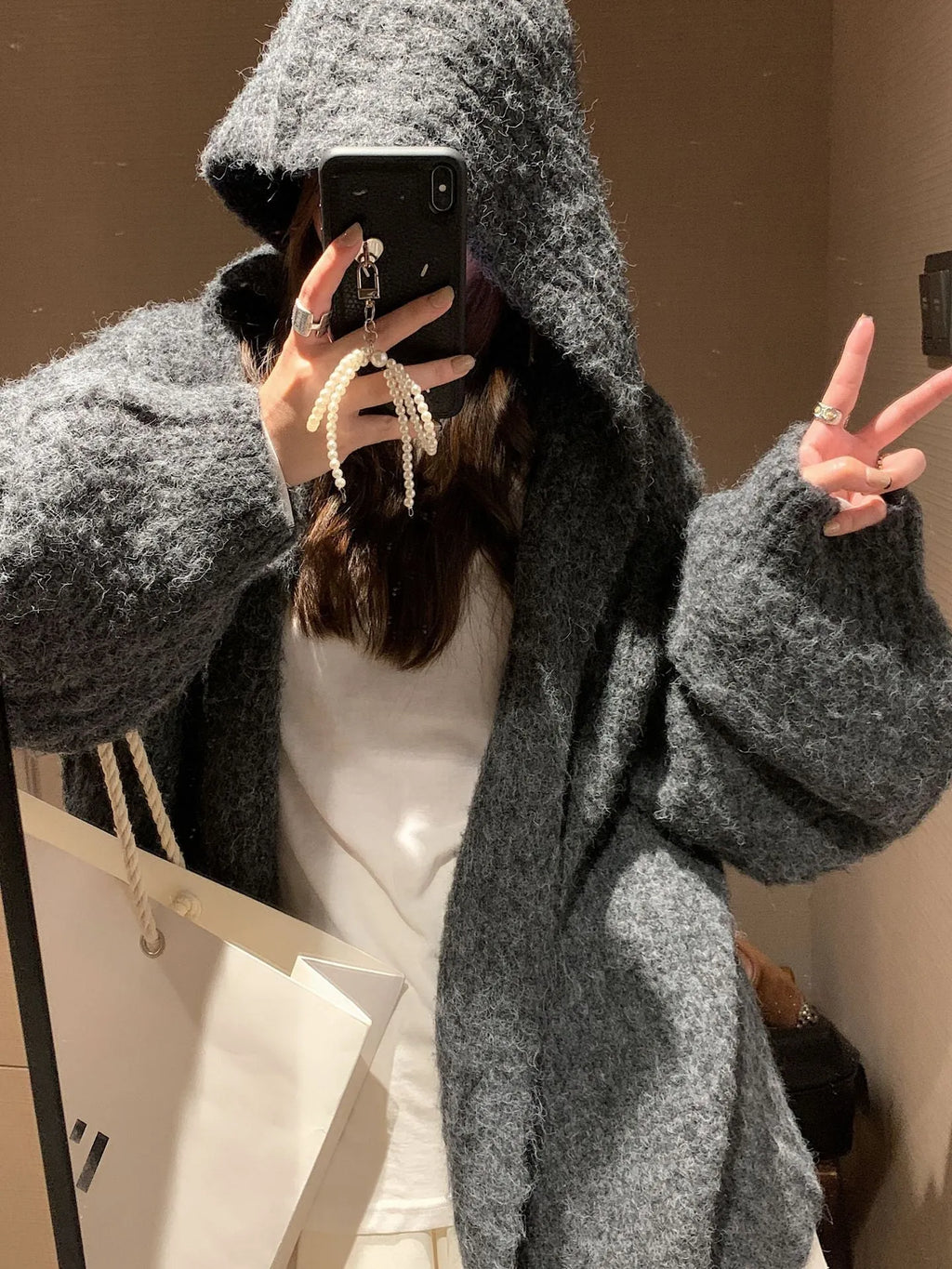 Women's thick grey hooded cardigan sweater with loose fit and regular sleeves
