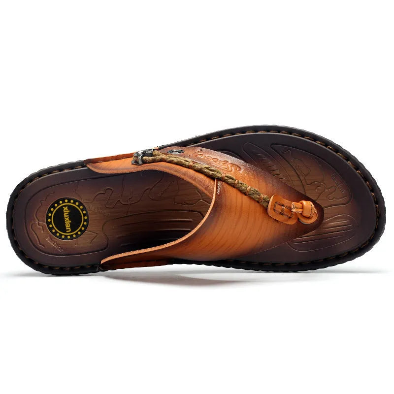 Men's dark blue herringbone pattern outdoor slippers with leather lining and a rubber sole.