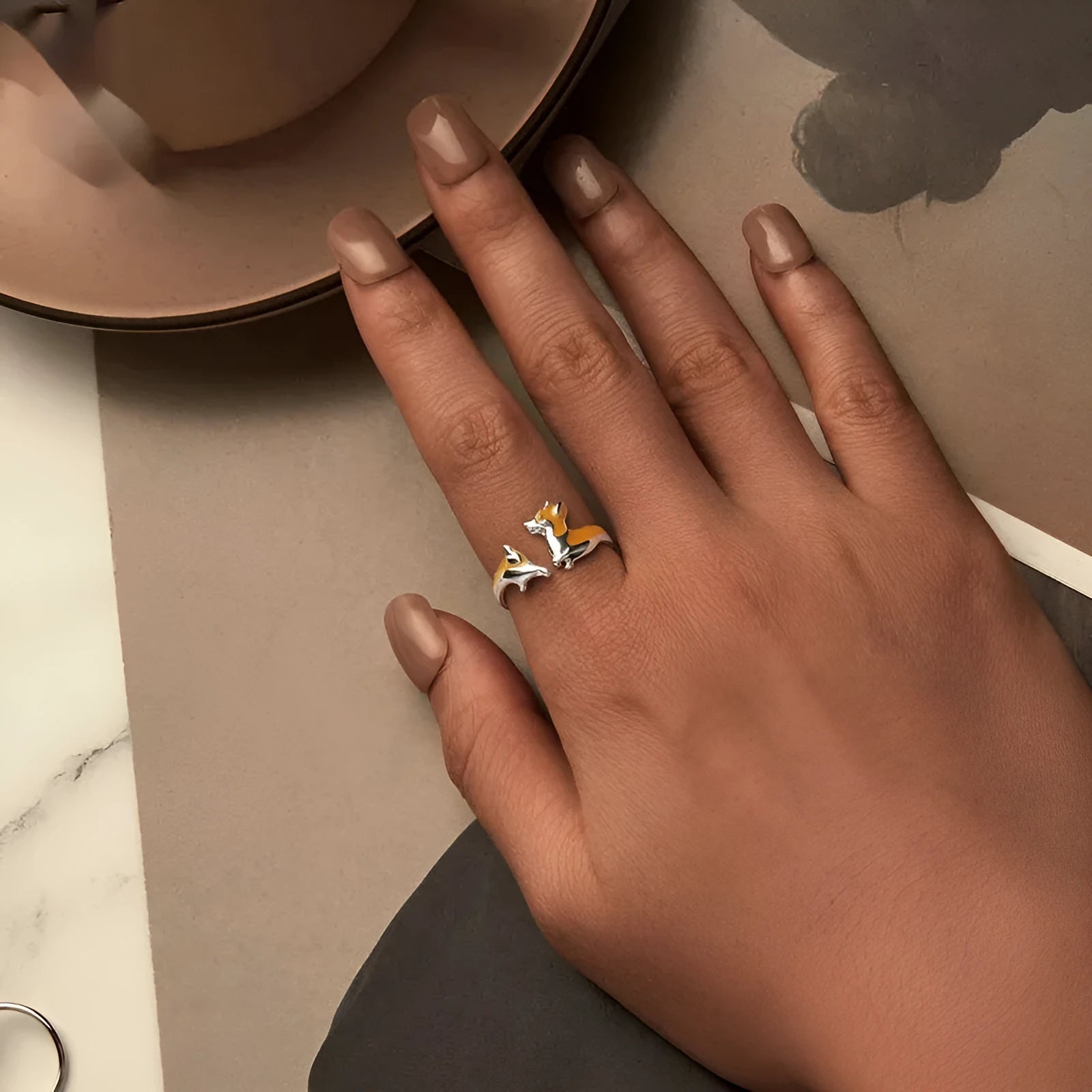 Silver-coloured adjustable ring with a detailed cartoon Corgi dog design.
