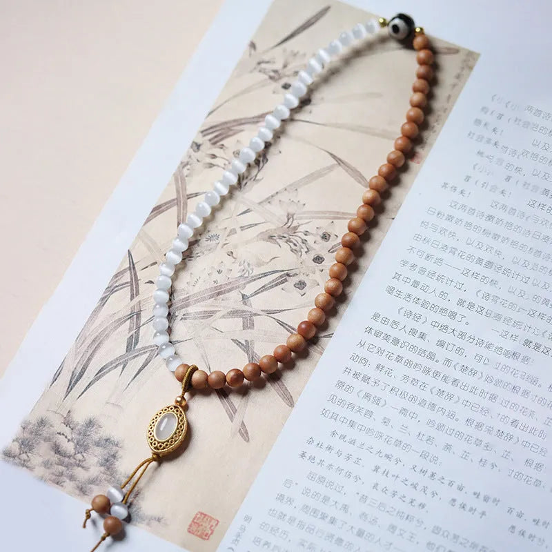 Sandalwood and opal Tibetan beads bracelet with polished double rings in Barbie colour