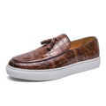 Men's black slip-on sneakers with tassel detail on the vamp and a round toe.