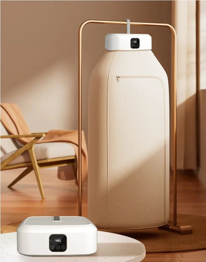 White cylindrical foldable clothes dryer with remote control showing compact 29cm height dimensions