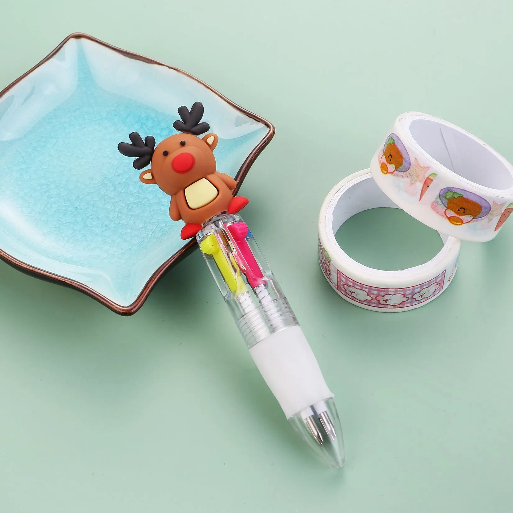 Christmas mini four-colour press-action ballpoint pen with festive designs measuring 11 cm.