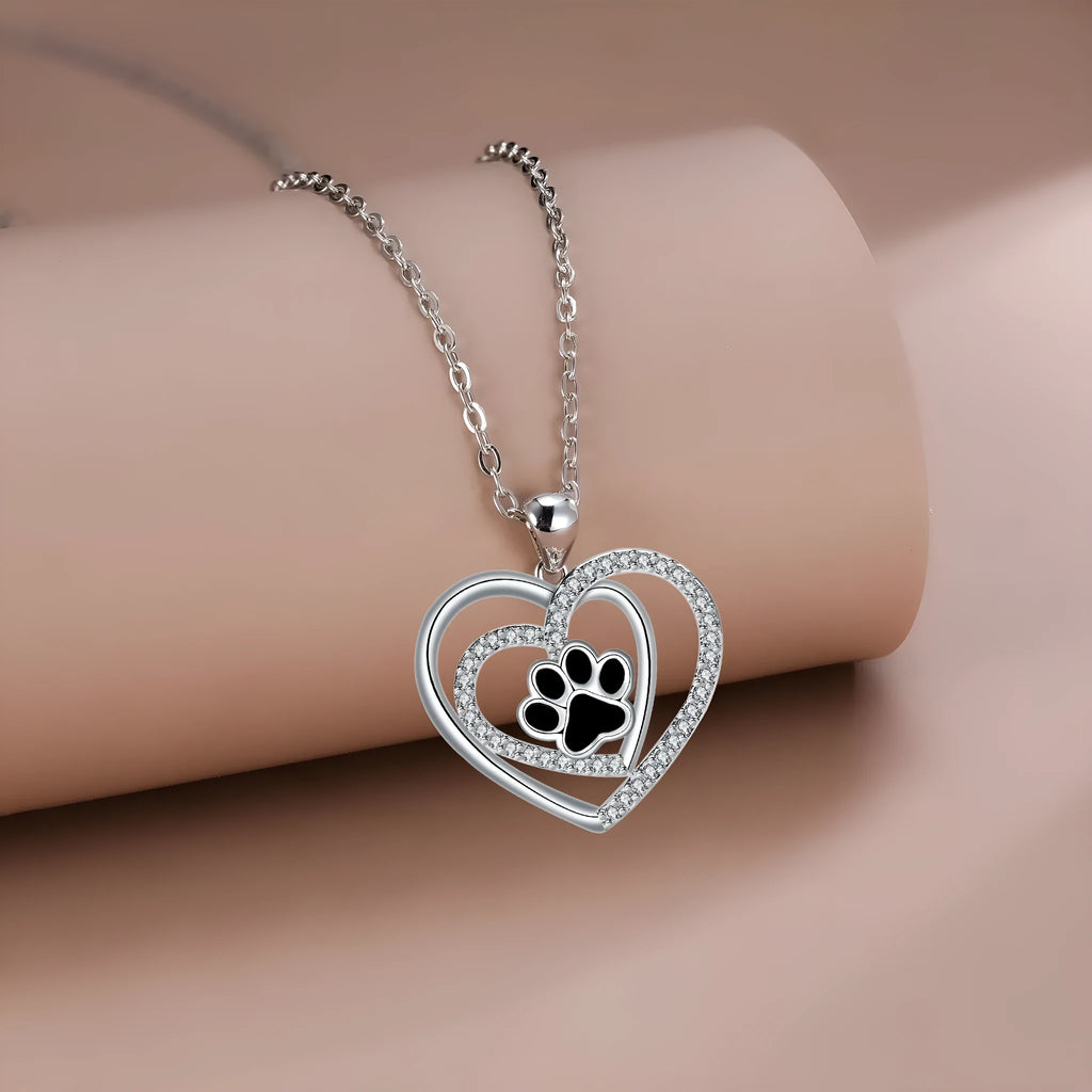 Women's copper heart-shaped pendant necklace with detailed dog's paw prints and cross chain