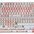 Pink mechanical keyboard keycap with a detailed fragrant pig design on all sides, shown next to a keycap puller tool.