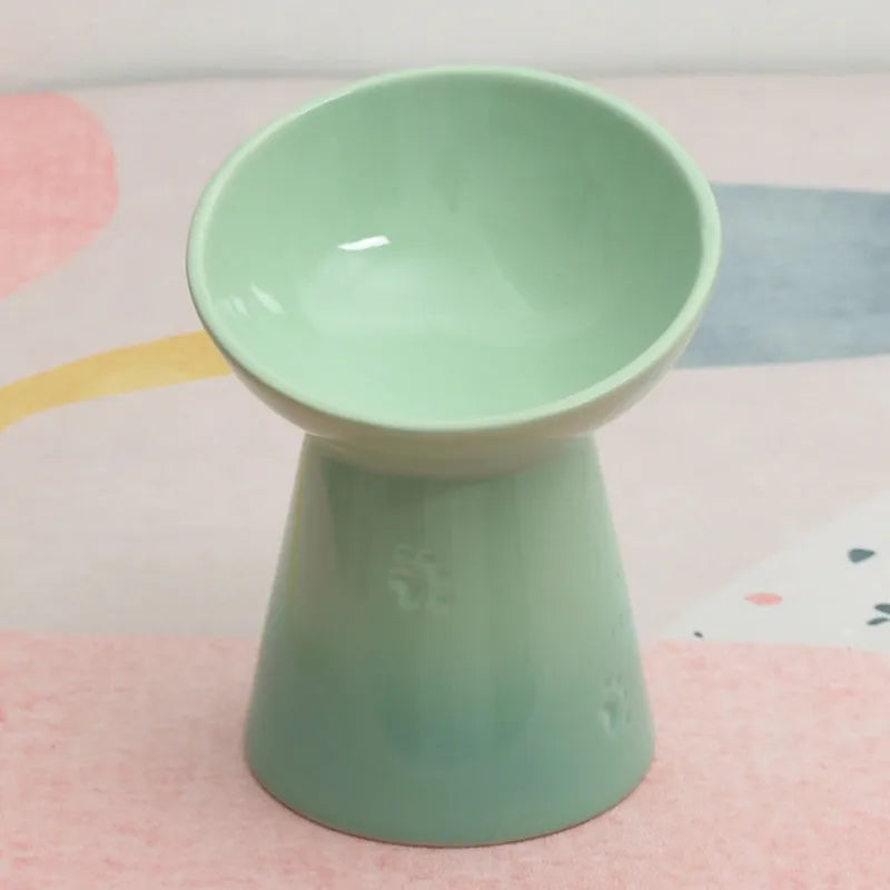 Ceramic pet bowl with high foot design showing anti-tumble stability feature