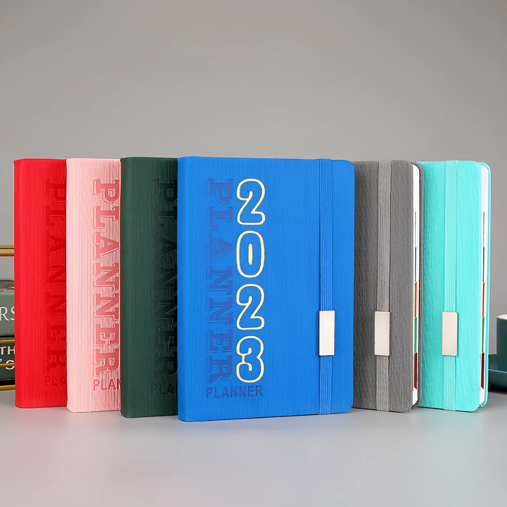 Student calendar notebook with imitation leather cover showing creative design and open calendar pages