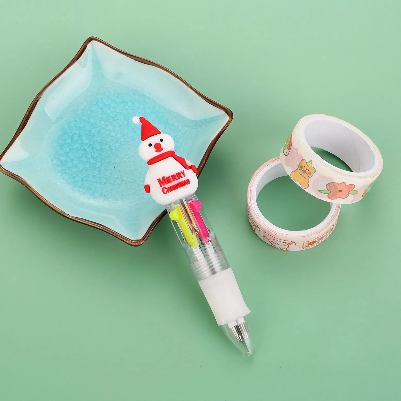Christmas mini four-colour press-action ballpoint pen with festive designs measuring 11 cm.