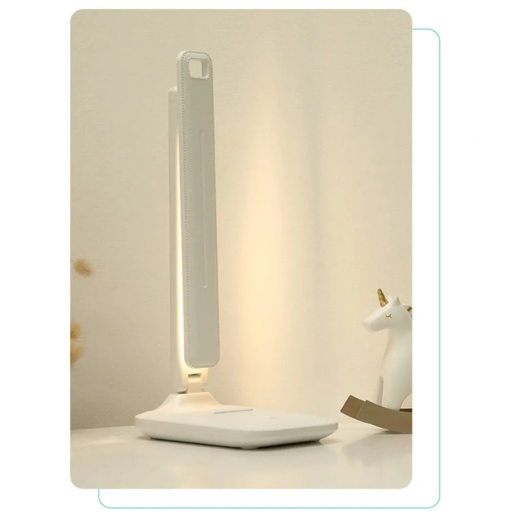 White plastic bedside lamp with touch dimming controls for children's bedrooms