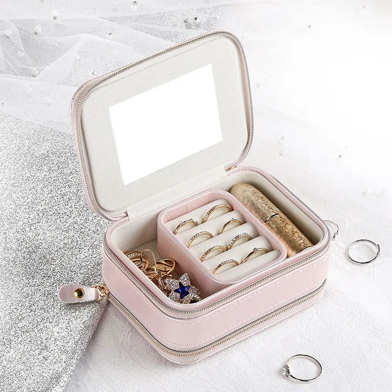 Light blue PU leather zipper jewellery box on a flat surface, compact 11.5x8.5x5cm size