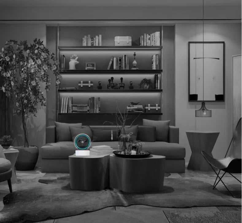 White indoor security camera with 360-degree rotation on stand showing WiFi connectivity