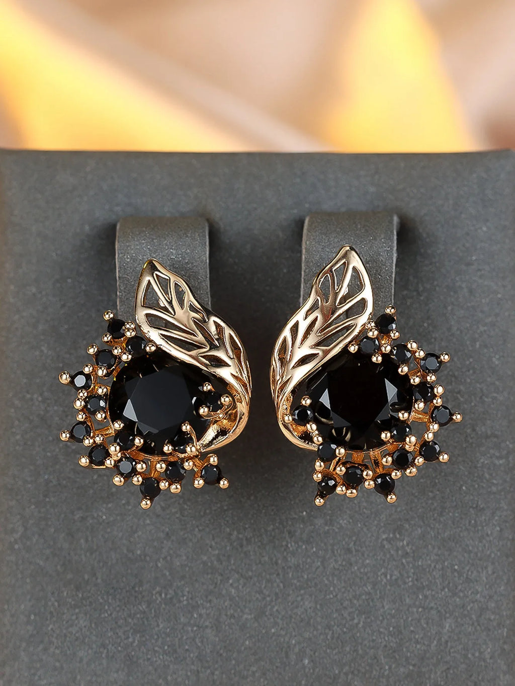Round floral earrings with feather zircon arrangement in champagne gold with six diamond colour options