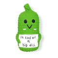 Green pickle-shaped squeaky dog toy with textured surface for dental cleaning during chewing