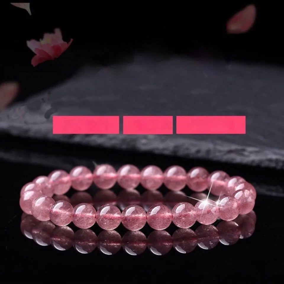 Women's strawberry quartz crystal bracelet with polished beads in 6mm, 8mm, and 10mm size options.