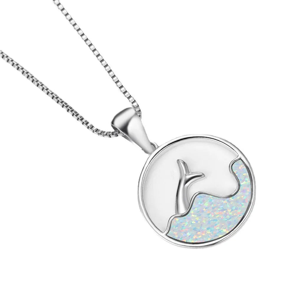White gold electroplated geometric fishtail pendant necklace with a round blue opal stone.
